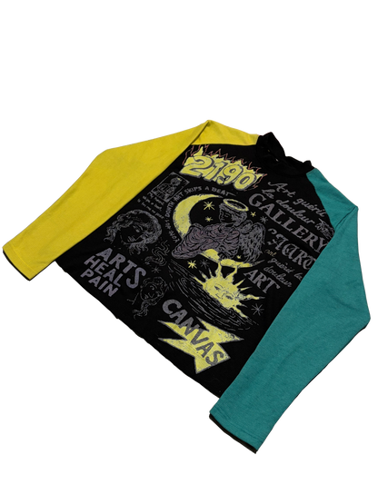 A long-sleeve raglan t-shirt with a black front graphic panel featuring a moon and sun illustration and text, with a bright yellow left sleeve and a teal right sleeve, shown on a plain white background.
